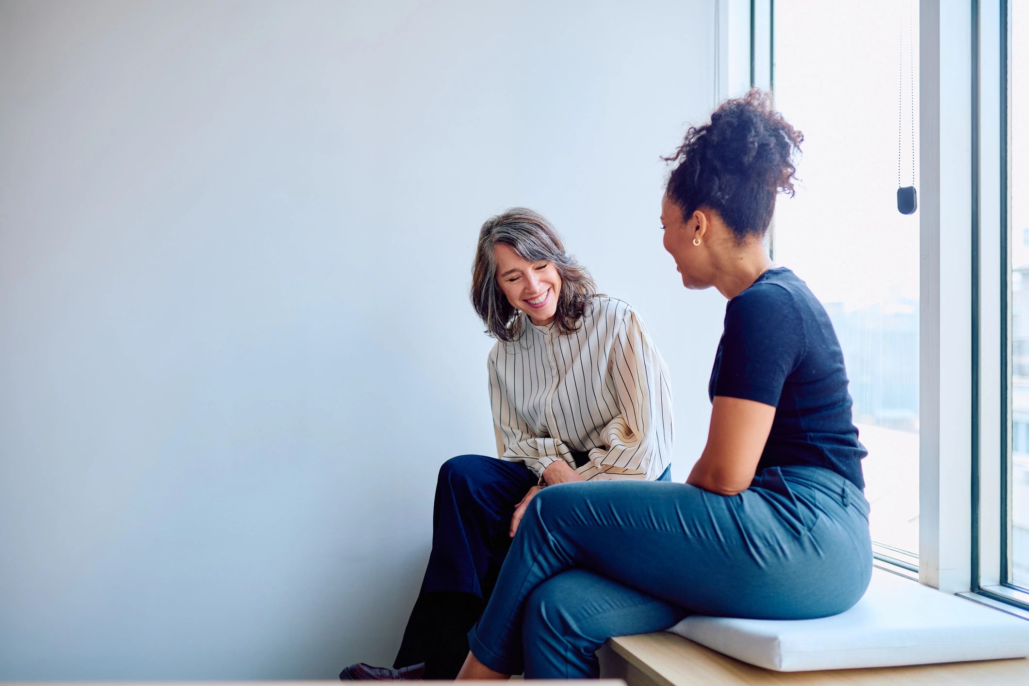 Two women having a supportive coaching conversation